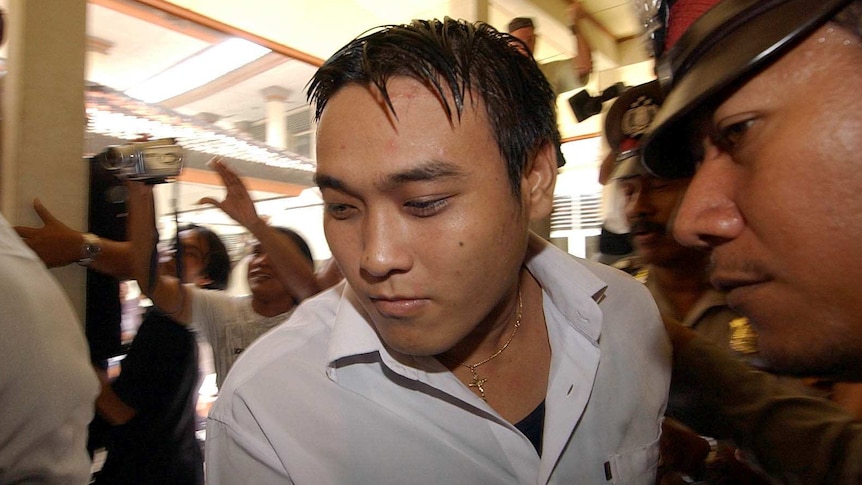 Tan Duc Thanh Nguyen being bought to a holding cell.