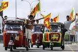 Sri Lankans celebrate their country's military victory over the Tamil Tigers