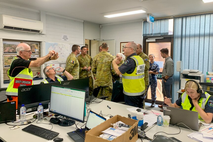 Members of the army and emergency services in an office at Broome, January 2023.