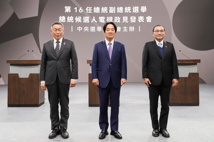 Three men posing for a TV debate