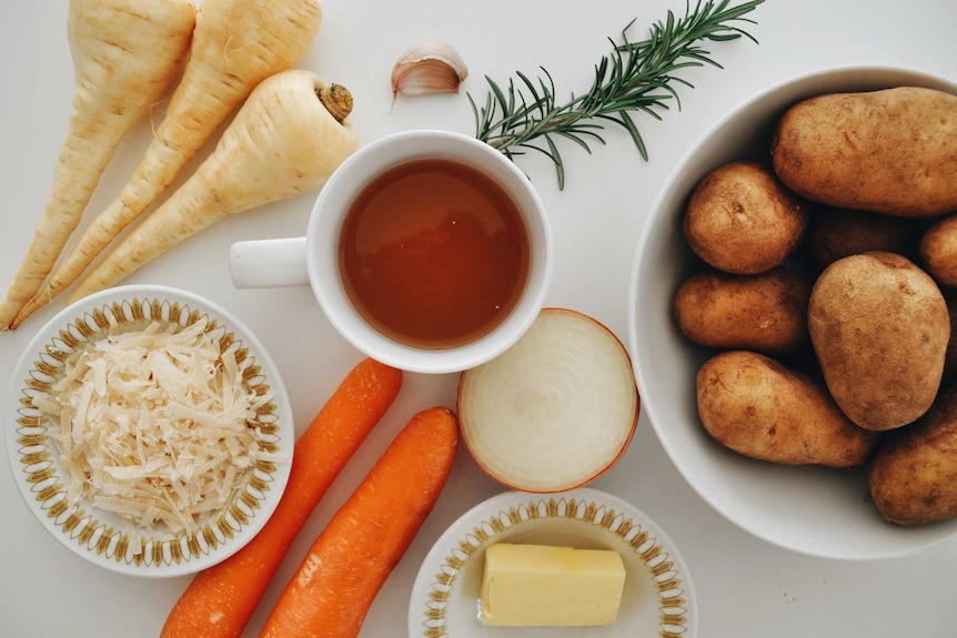 Parsnips, parmesan, carrots, onion, potatoes, garlic, rosemary and butter are key ingredients of a vegetarian stew.