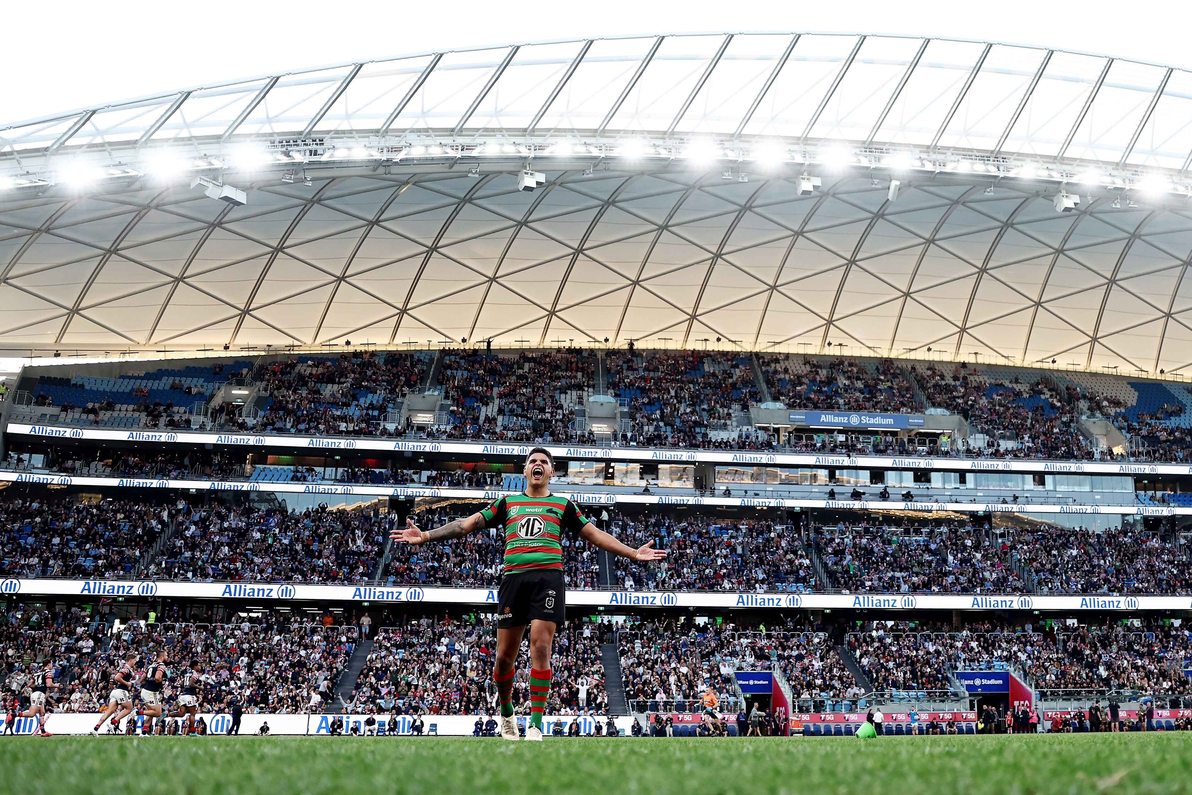 A man celebrates after kicking a conversion