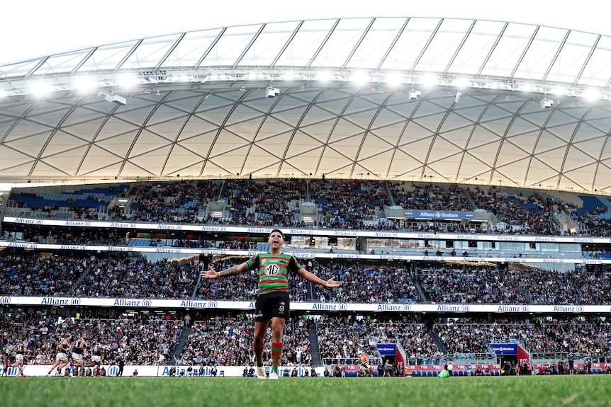 A man celebrates after kicking a conversion