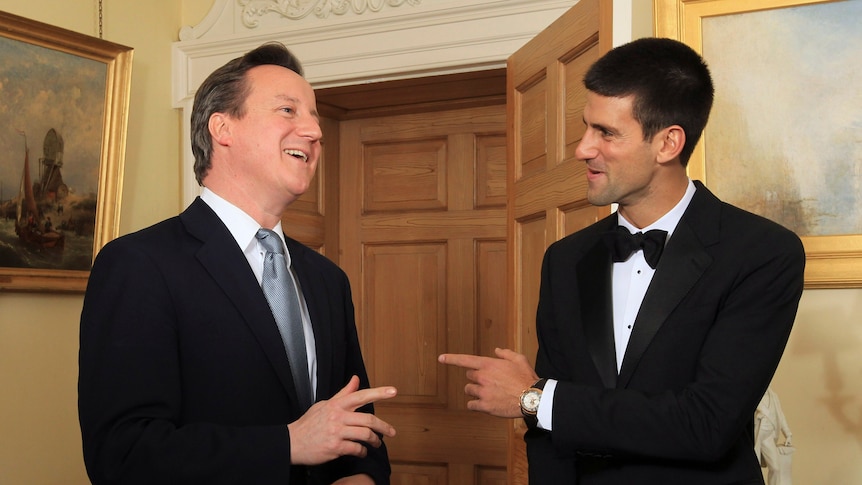 Tennis player Novak Djokovic (right) talks with British Prime Minister David Cameron