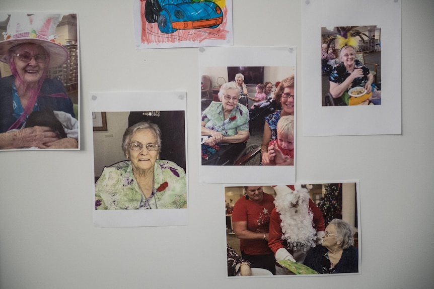 Wall with pictures of Dorothy Major and relatives at her aged care facility.