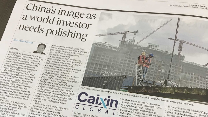 A page of the Australian Financial Review newspaper showing a story from China's Caixin Global.