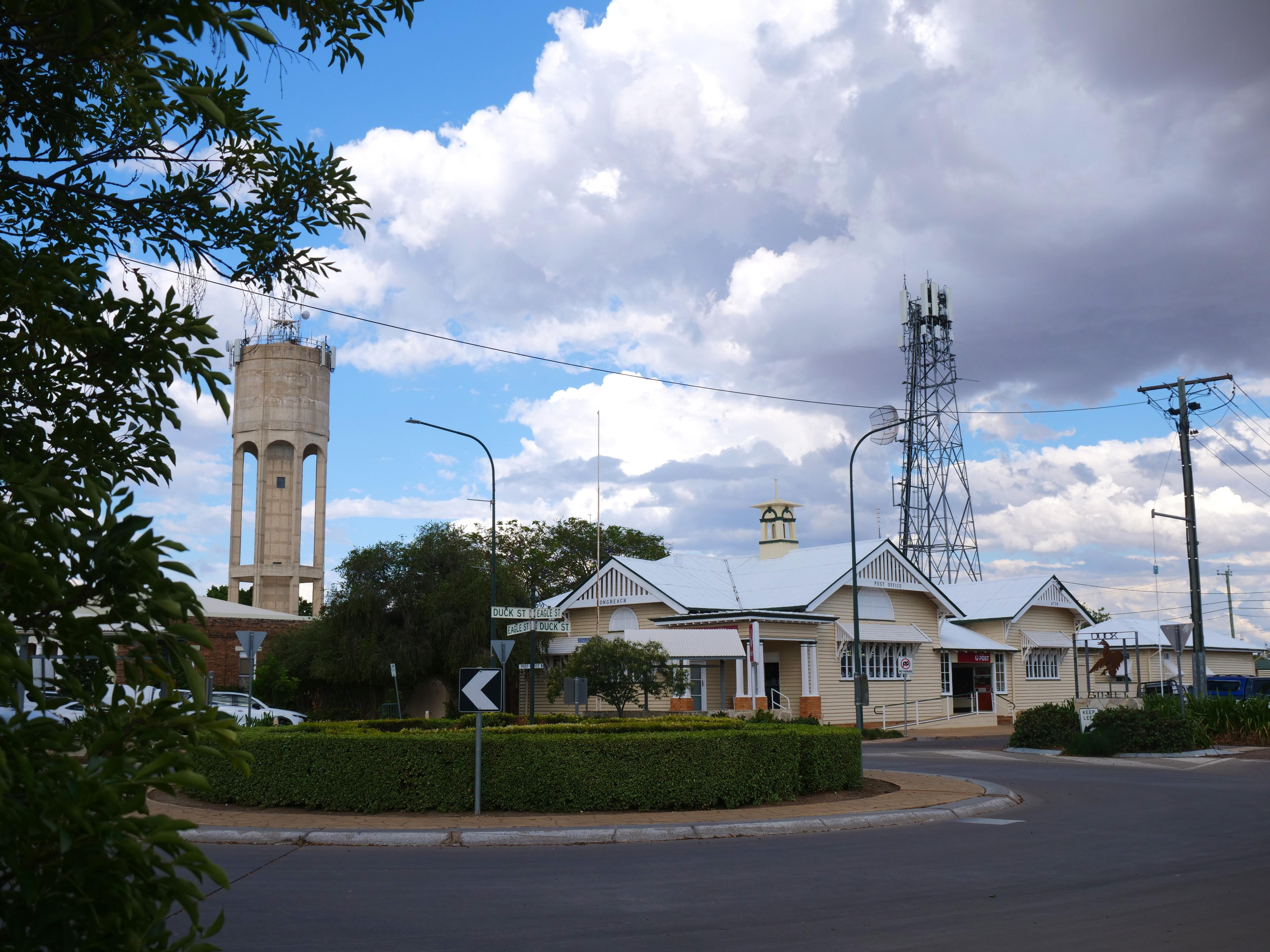 Wooden heritage post office building with water tower off to the side