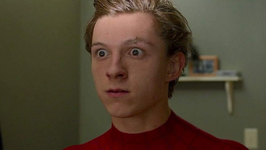 Close-up of Tom Holland with his eyes wide open as Peter Parker in Spider-Man: Homecoming