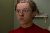 Close-up of Tom Holland with his eyes wide open as Peter Parker in Spider-Man: Homecoming
