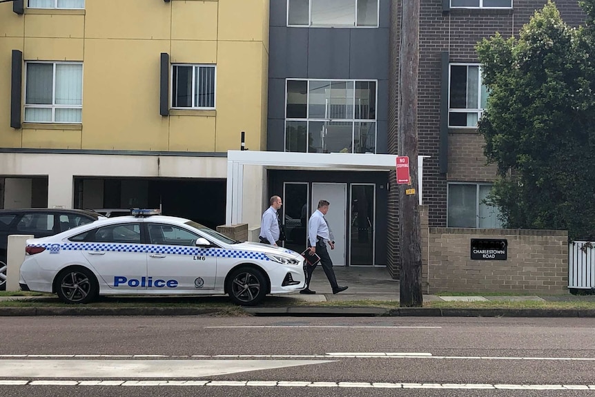 Police car parked outside unit block in Charlestown.