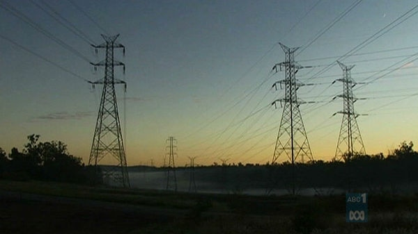 High tension power line towers at dusk