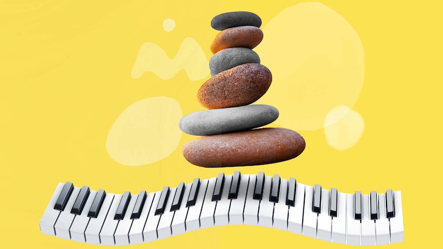 A stack of pebbles sits above a wavy piano keyboard on a bright yellow background.