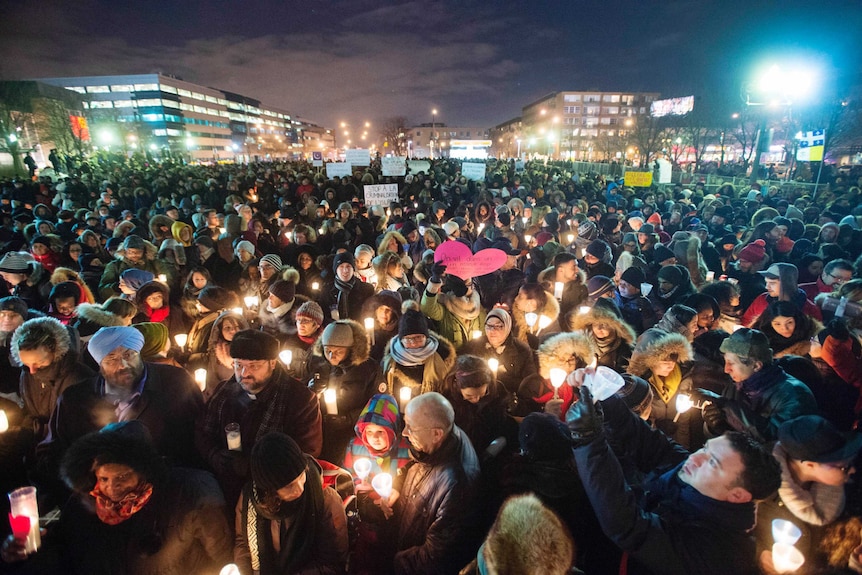 Large crowds assemble for a candlelit vigil in Montreal