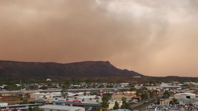 File photo: Storm gathers over Alice Springs (ABC News: Georgia Stynes)