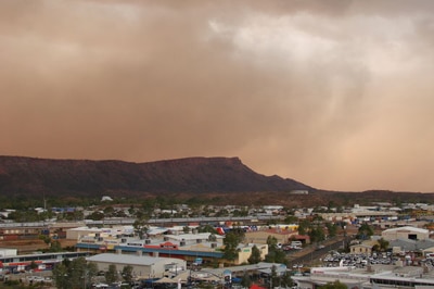 File photo: Storm gathers over Alice Springs (ABC News: Georgia Stynes)