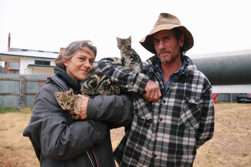 Cherrie Meloury and Wayne Ryan holding newborn kittens.