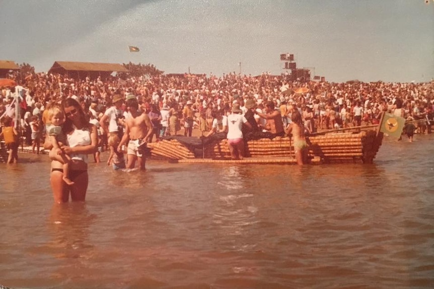 Large crowd on Darwin beach in 1970s.