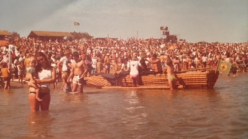 Large crowd on Darwin beach in 1970s.