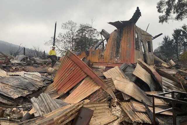 The burnt rubble of a house destroyed by fire