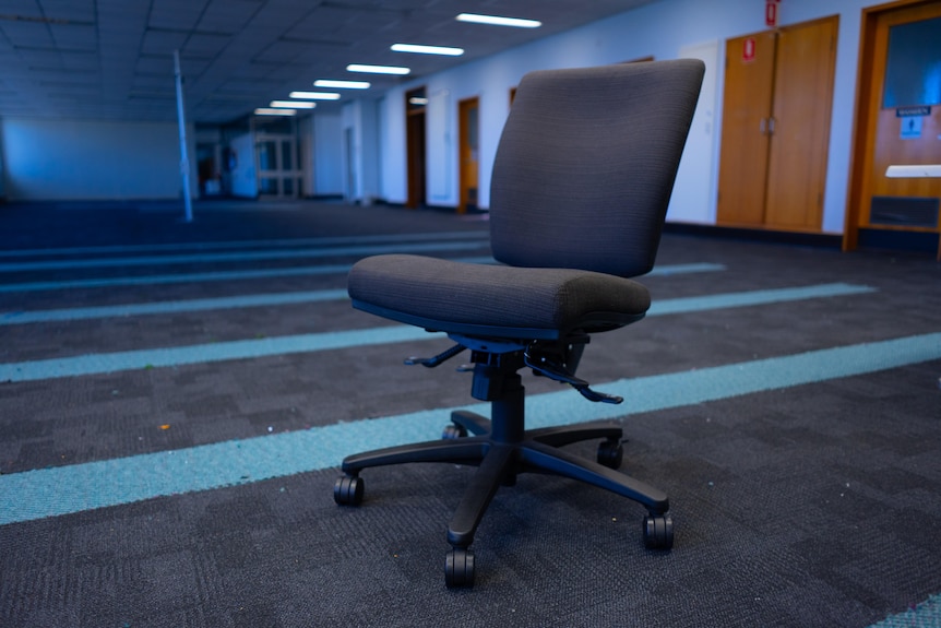 A chair in an empty office.