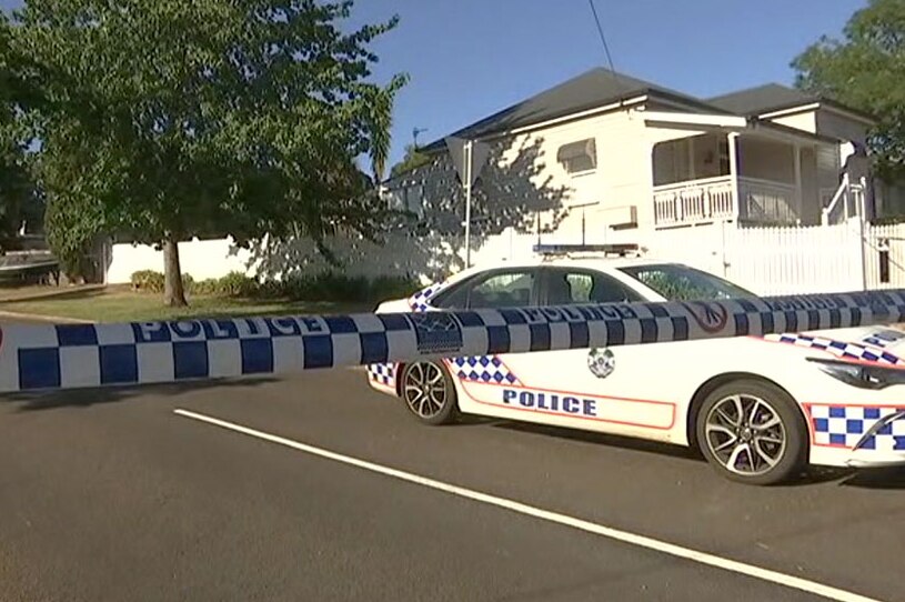 Police car and tape across a street in Toowoomba.
