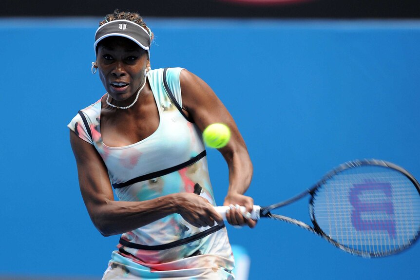 Letting rip ... Venus Williams returns Galina Voskoboeva's serve.