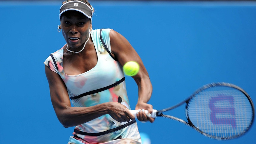 Letting rip ... Venus Williams returns Galina Voskoboeva's serve.