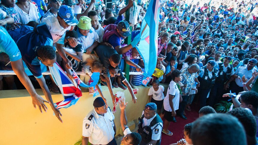 Fans greet Fiji's Olympic gold-medal-winning men's sevens rugby team.