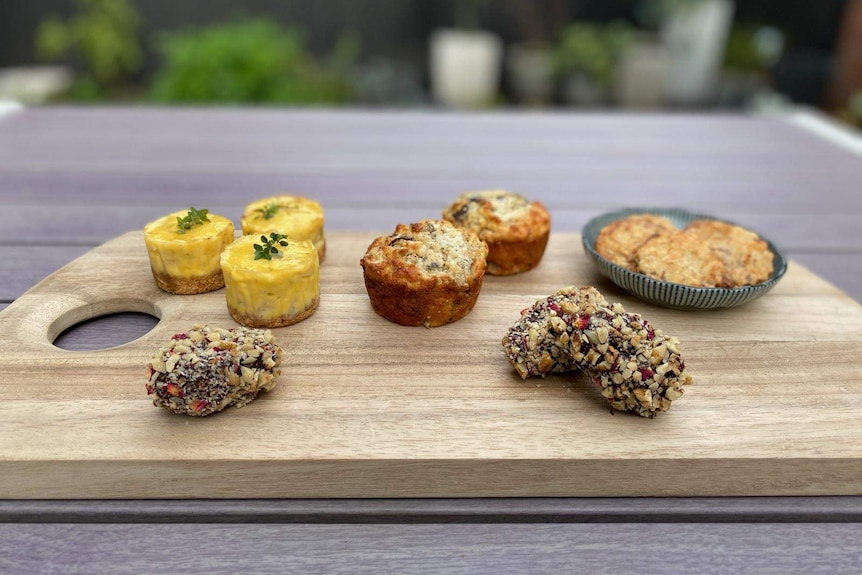 A selection of baked goods on a cutting board.