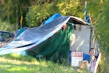 Tent and camp of homeless person in Australia, location and date unknown.