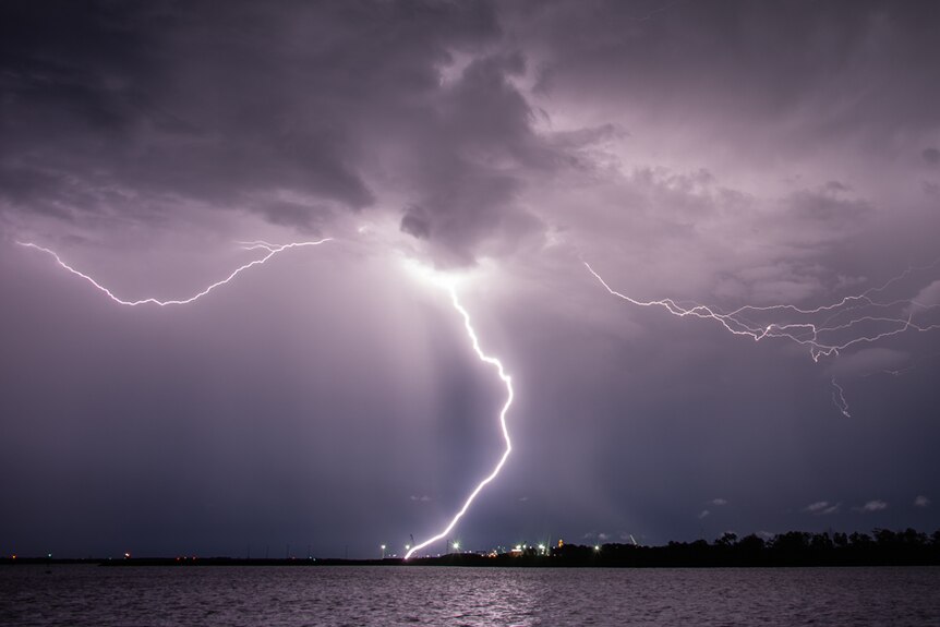 A lightning bolt emerges from the clouds over Darwin. 