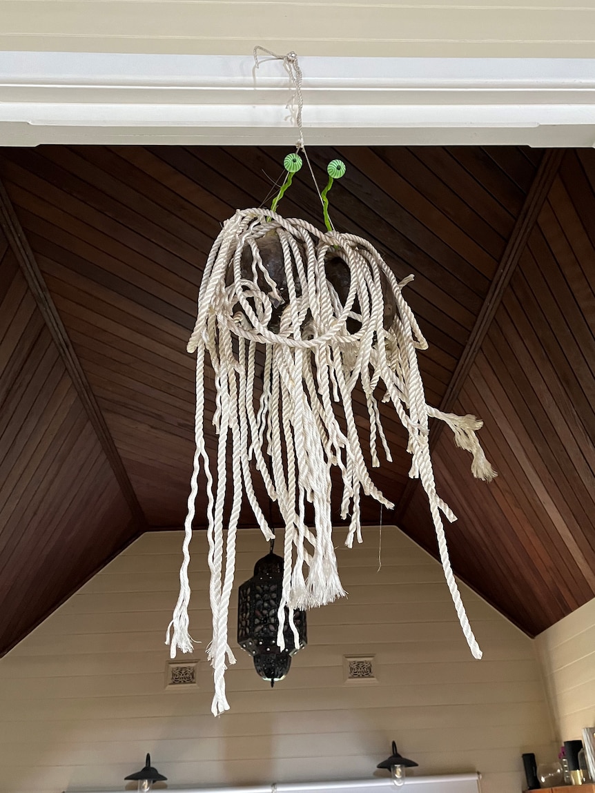 A model of the flying spaghetti monster made of rope hangs in a converted church.