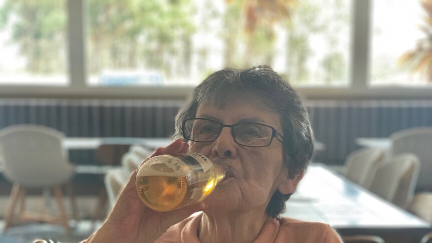Ann Fahey drinking a beer