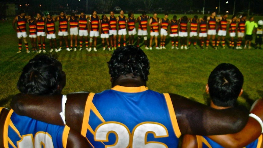Footballers line up before a game in Kununurra.