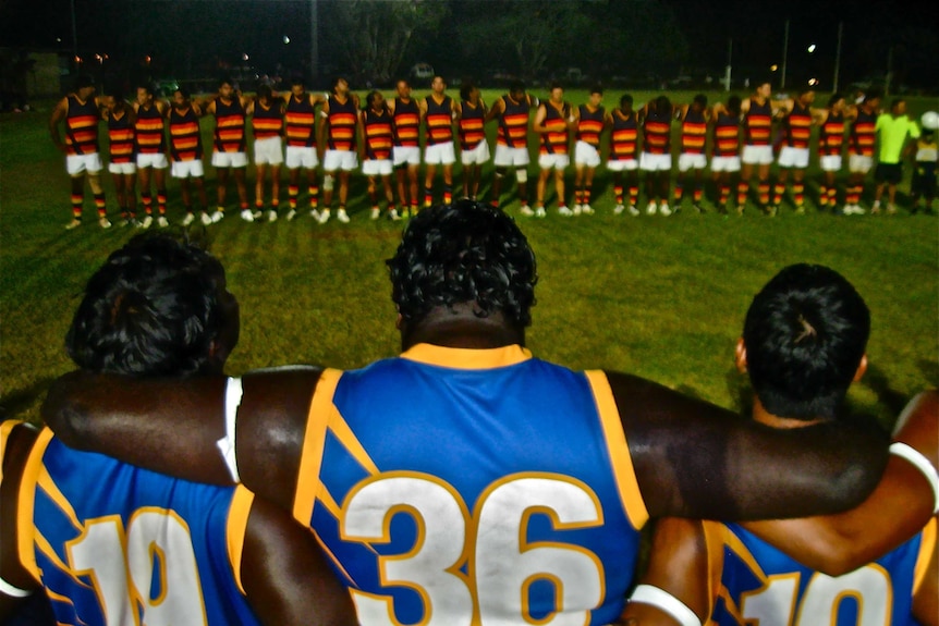 Footballers line up before a game in Kununurra.