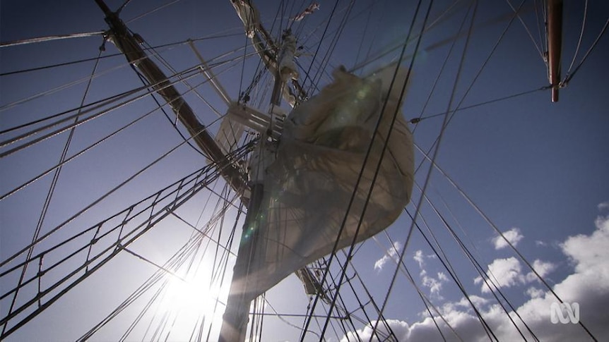 A view upwards towards tall ship's mast