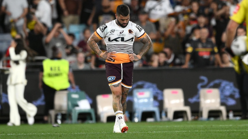 Brisbane Broncos captain Adam Reynolds walks with his hands on his hips after the NRL grand final.