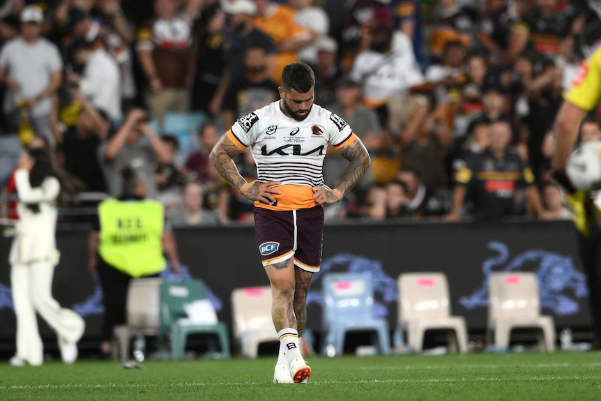 Brisbane Broncos captain Adam Reynolds walks with his hands on his hips after the NRL grand final.
