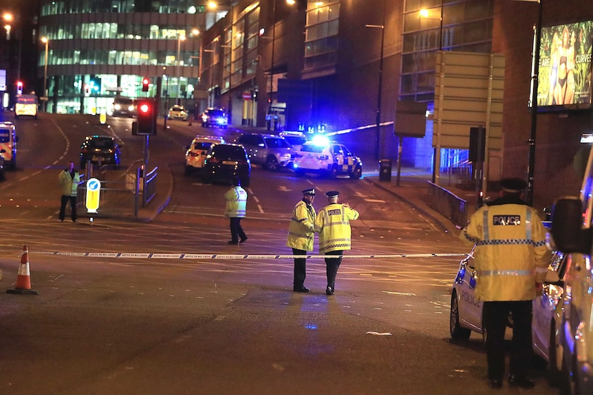 Emergency services work at Manchester Arena after reports of an explosion at the venue