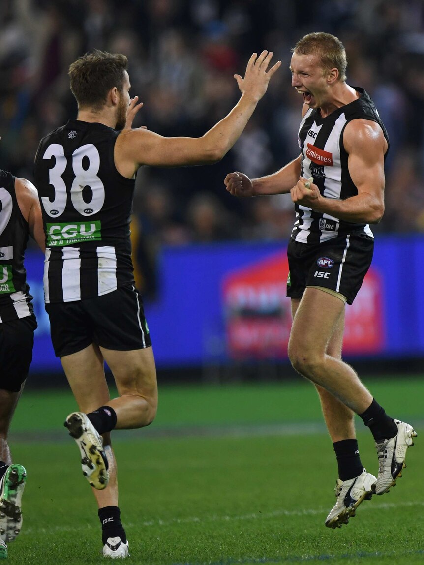 Collingwood's Josh Smith celebrates a goal against Hawthorn