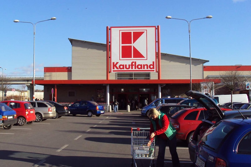 The front of a supermarket with the car park