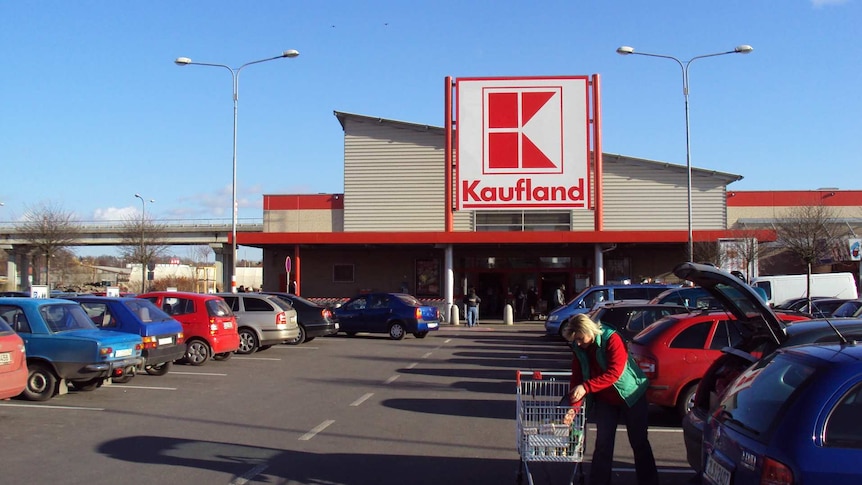 The front of a supermarket with the car park