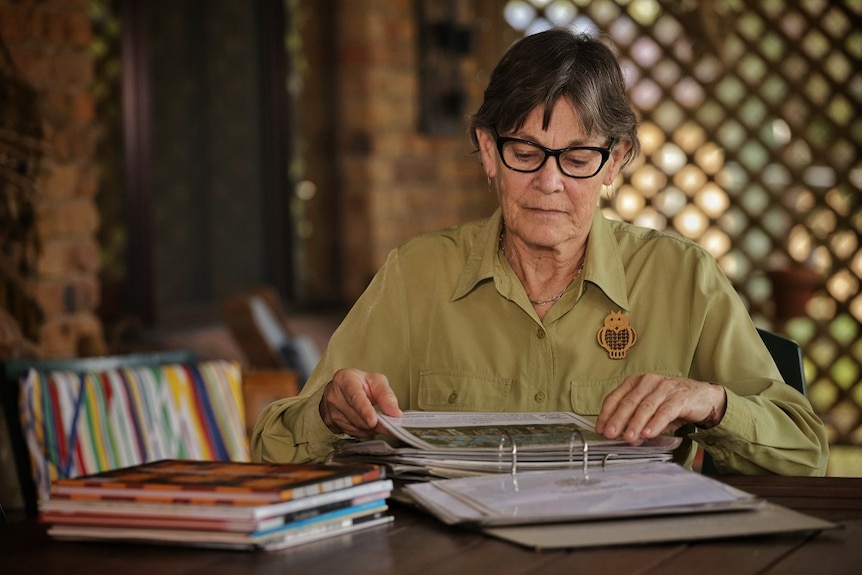 Penny Adams looks at school photos.