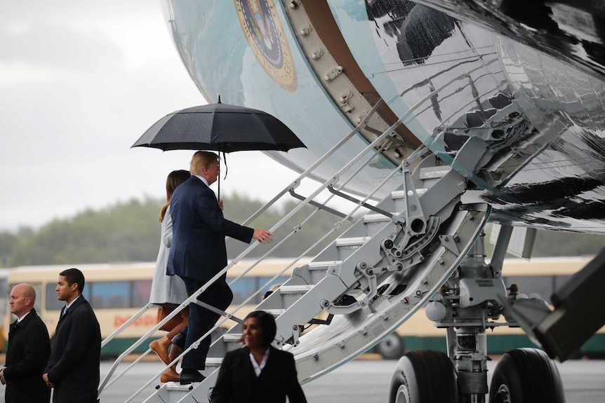 U.S. President Donald Trump and his wife Melania board Air Force One