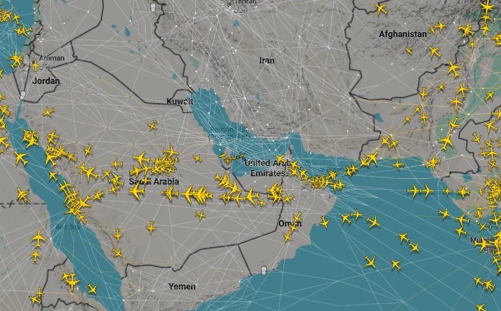 A map of the middle east shows many crossing paths that airplanes can take, with white markers along them.