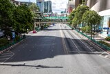 The busy Ratchaprasong intersection in Bangkok lies empty on the first day of new restrictions.