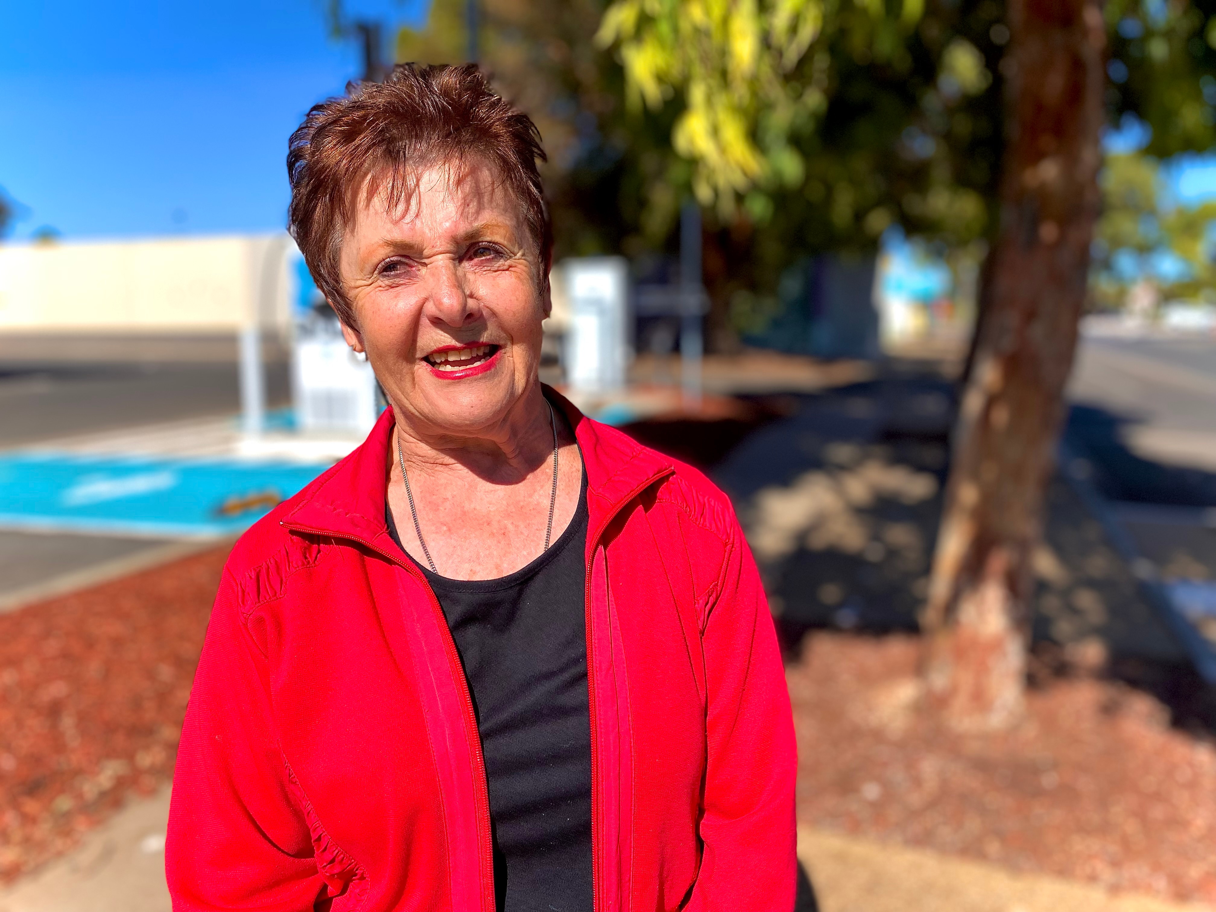 A woman in a red jacket