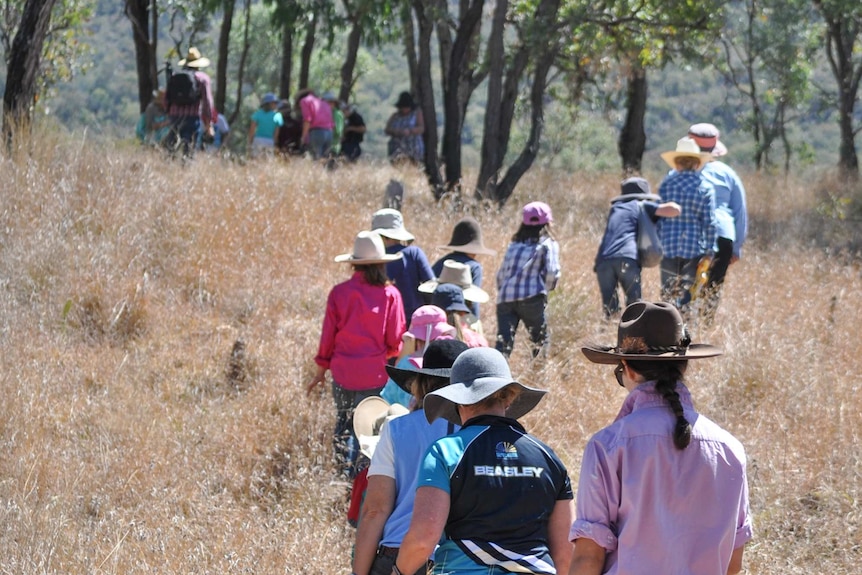 Children walk into the scrub