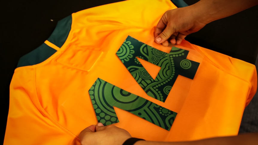 Indigenous pattern being put on the playing number of rugby union jersey