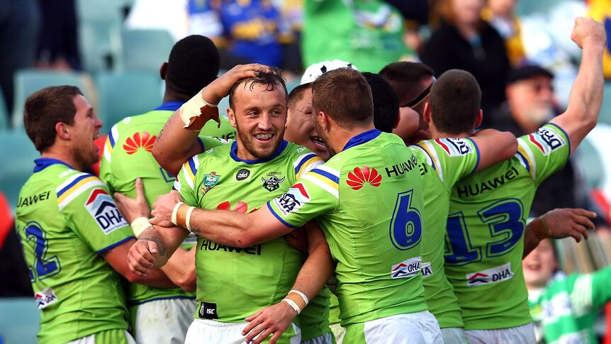 Josh Hodgson all smiles after scoring try for Canberra